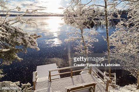 Beautiful View Of Lake Pyhäjärvi Snowy Trees And Pier And Snow Falling