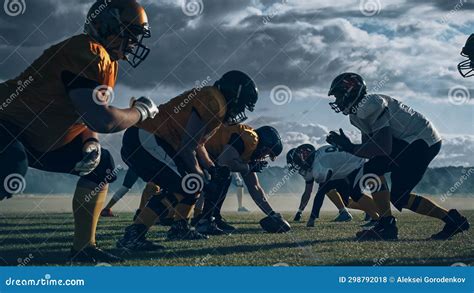 Two Professional American Football Teams Stand Opposite Each Other