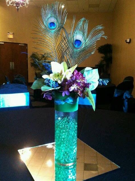 beautiful flower and peacock feather center piece stylish eve peacock wedding theme wedding