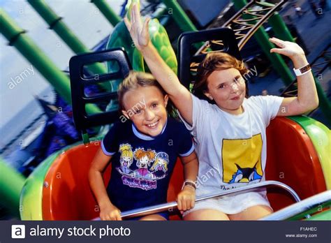 Two Girls Screaming On The Green Scream Roller Coaster At