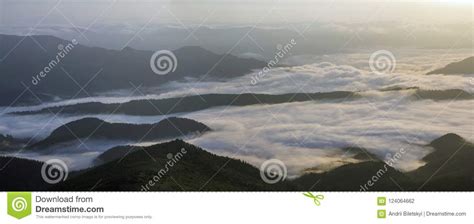 Fantastic View Of Mountain Valley Covered With Low White Puffy L Stock