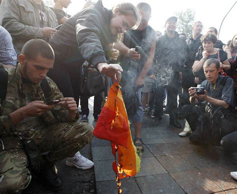 riot police protect kiev pride march as homophobic protestors burn lgbt flags daily star