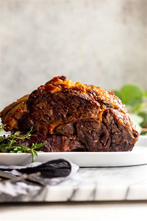 Following the line of the bones, cut the meat away from the bones in 1 piece. Slow Roasted Prime Rib Recipe