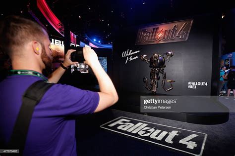 A Game Enthusiast Takes A Photograph Of A Mr Handy Robot In News
