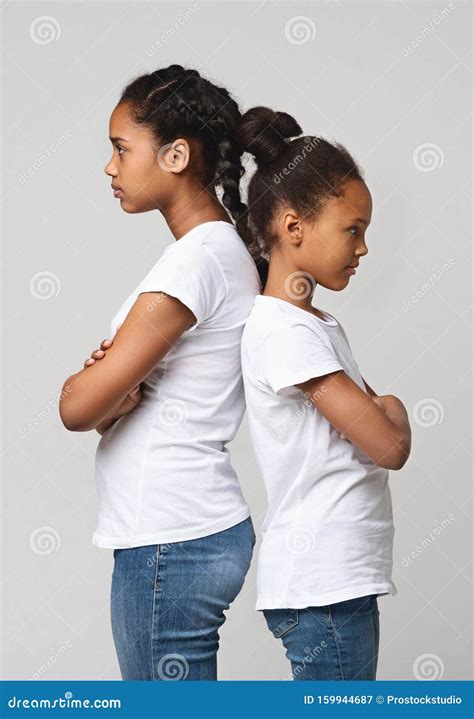 Portrait Of Angry Sisters Staying Back To Back Stock Image Image Of