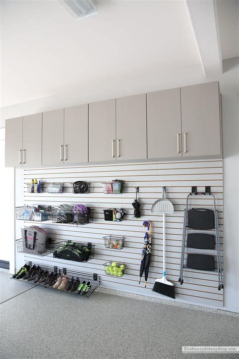 An Organized Garage With Lots Of Storage And Hanging Items On The Wall Including Shoes