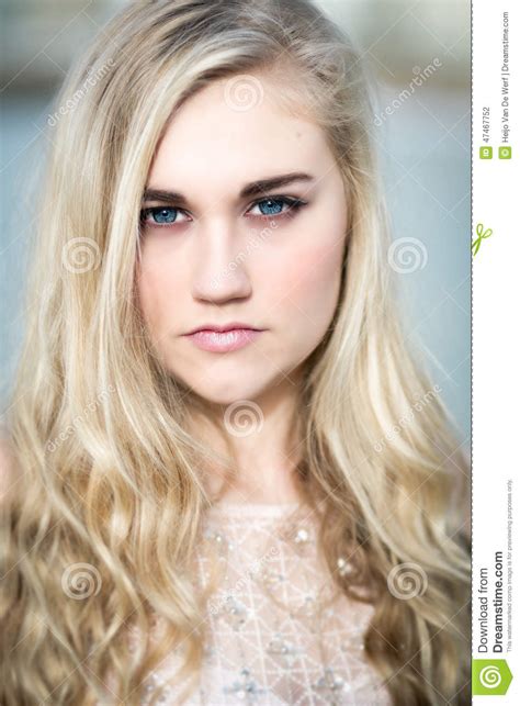 Beautiful Blond Teenage Girl With Blue Eyes Stock Photo