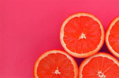 Premium Photo Top View Of A Several Grapefruit Slices On Bright