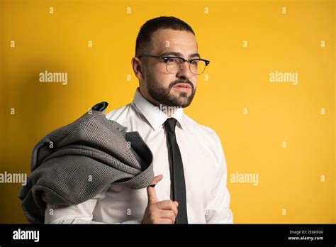 Portrait Of A Good Looking Young Man Looking Serious With Beard Dressed