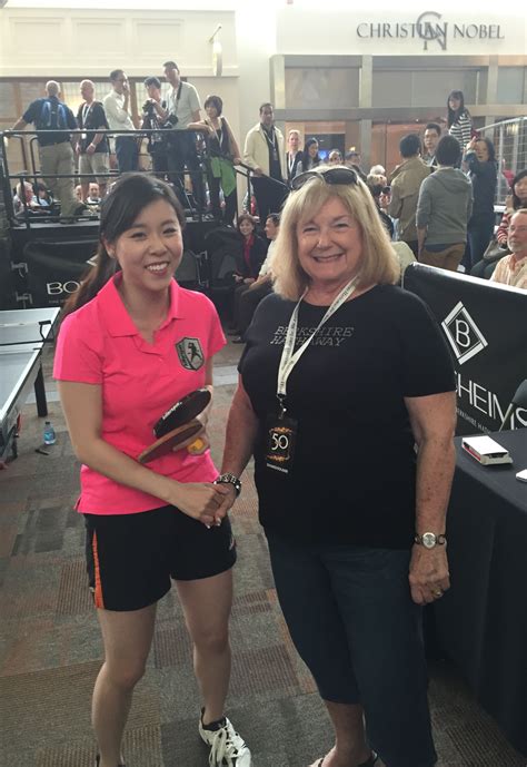 2015 05 03 cheryl plays ping pong with ariel hsing at borsheim s in omaha nebraska at the