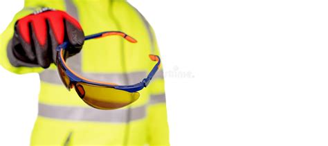 Construction Worker In A Bright Yellow Hi Viz Coat And Red Safety Gloves Giving Tinted Safety