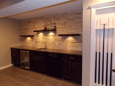 Maybe you would like to learn more about one of these? CMH Builders Wet bar with floating shelves on stacked ...