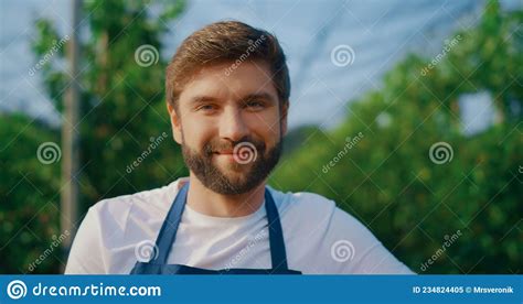 Professional Farm Worker Smiling Camera In Summer Orchard Happy Farmer Posing Stock Image