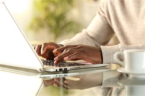 Black Man Hands Typing On A Laptop At Home Stock Photo Download Image