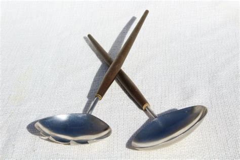 If washing by hand, clean in the direction of the brushed stainless steel to preserve beauty. mod vintage salad servers made in Japan, stainless steel ...