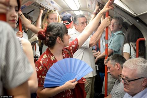 millions of london underground commuters in packed carriages hotter