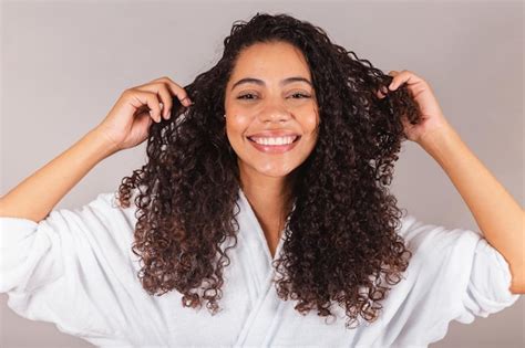Premium Photo Brazilian Black Woman Wearing Bathrobe And Towel Curly