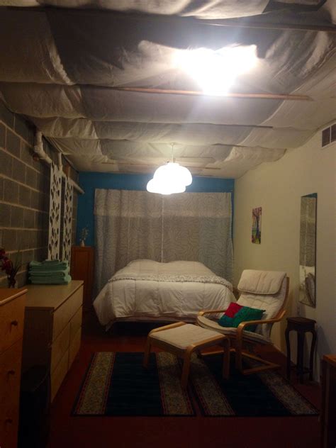 If you want to use a partly finished basement and cover the ceiling with something temporary until you can completely finish the space, consider fabric. DIY basement ceiling. Cover with sheets and staple to ...