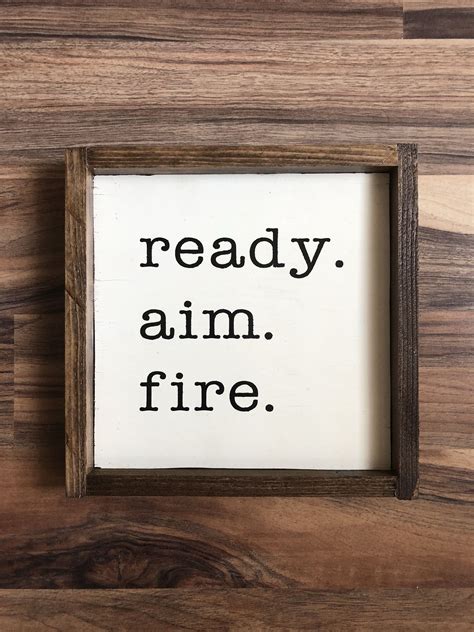Get positive and fulfilling energy through feng shui in your home. Bathroom wall decor - Ready. Aim. Fire. framed wood sign ...