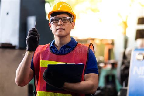 Portrait Asian Engineering Man In An Industrial Manufacturing Facility