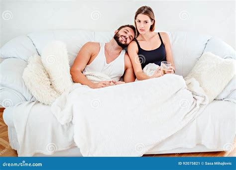 Couple Lying On The Couch And Drinking Coffee Stock Image Image Of