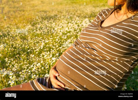 Beautiful Pregnant Woman Relaxing Outside In The Park Stock Photo Alamy