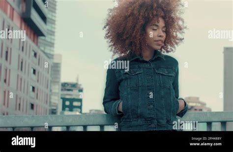Black Mixed Race Woman With Big Afro Curly Hair In Outdoor City Stock