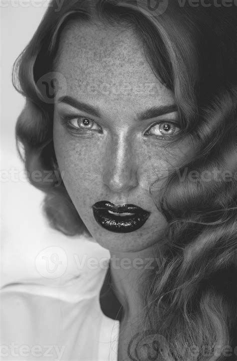 Black And White Photo Of Seductive Girl With Freckles Looking At Camera