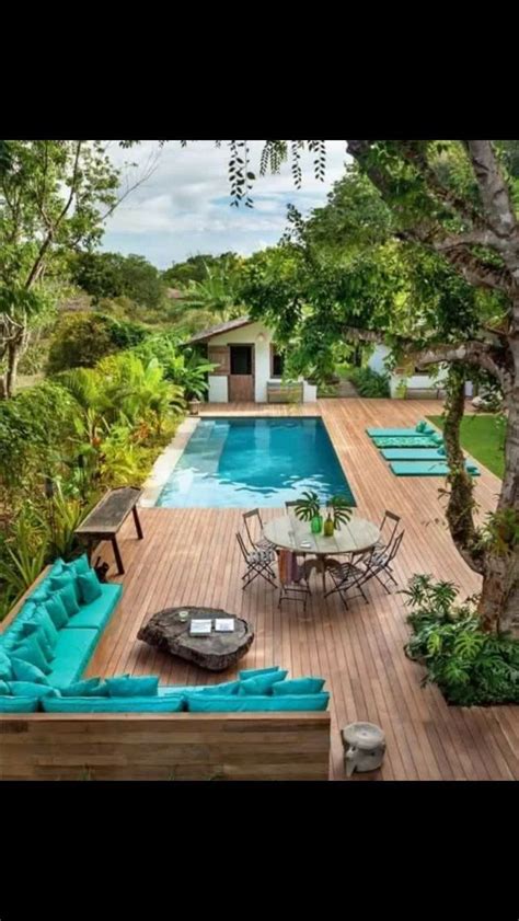 Above ground pools have become popular in a really short span of time. Above ground pool with build around wood panel deck ...