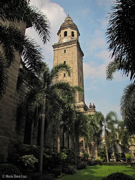 The Clock Tower Of The Manila Cathedral And The Surrounding Gardens