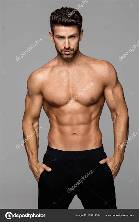 Fitness Male Model Posing Stock Photo By ©kiuikson 169217314