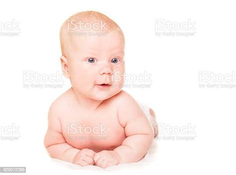 Happy Young Baby Lying On Tummy Isolated Stock Photo Download Image