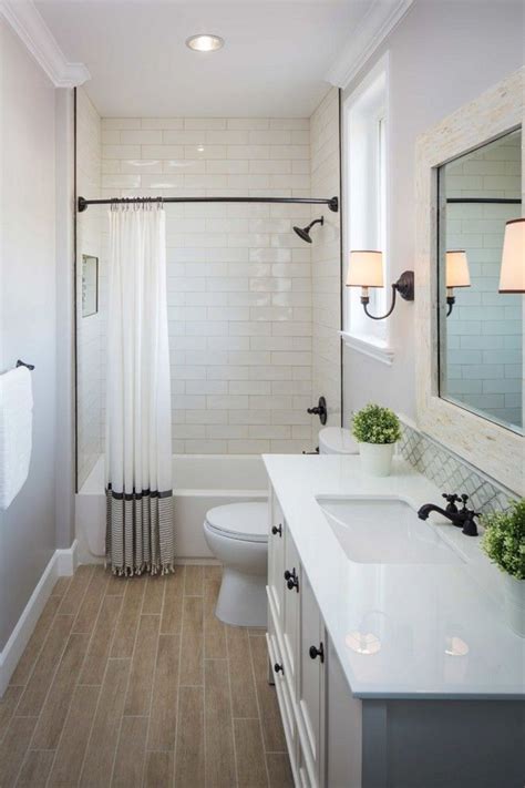 Opt for a shade that gives your bathroom exactly what it needs—whether that's contrast or congruence. Simple Bathroom With White Tile Ideas - MOOLTON