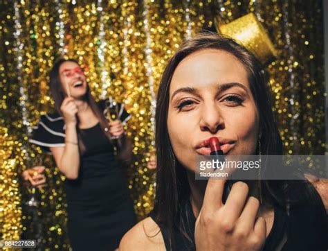 Woman Putting On Red Lipstick Photos And Premium High Res Pictures