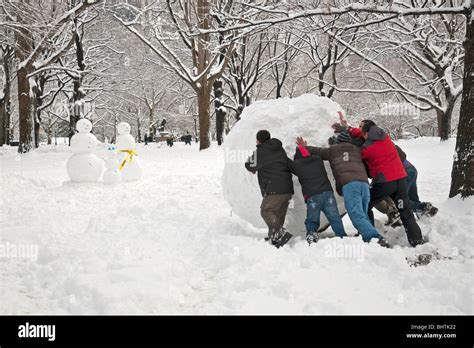 People Building A Snowman In Central Park During Record Snowfall On