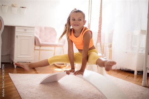 Little Girl Stretching Stock Photo Adobe Stock