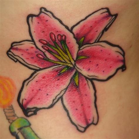 There are also women who have decided to ink stargazer tats on their rib cage. Beautiful Pink Stargazer Lily Tattoo Design