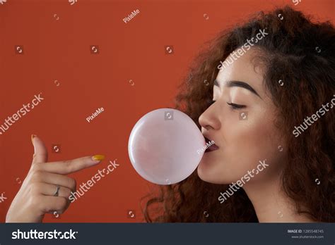 Young Woman Blowing Bubble Gum Close Stock Photo 1285548745 Shutterstock