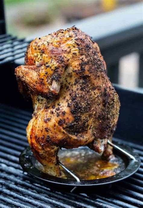 grilled whole chicken recipe for both gas and charcoal grills garnish with lemon