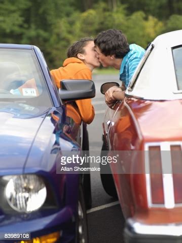 Check out the tab ». Couple Kissing In Their Cars High-Res Stock Photo - Getty ...