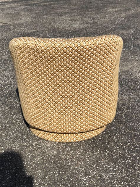 The swivel chair's plush seat and back cushion promise comfort, while the swivel base lets you move about with ease. Barrel Back Swivel Club Chair with Ottoman by Directional ...