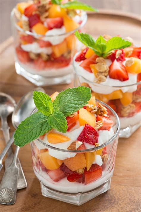 Fruit Dessert With Whipped Cream Mint And Granola Top View Stock