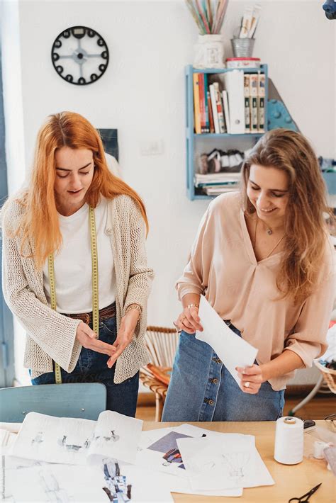 Two Young Female Fashion Designers Working Together At The Design