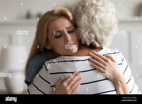 Teen granddaughter embrace loving grandma feeling empathy share mental