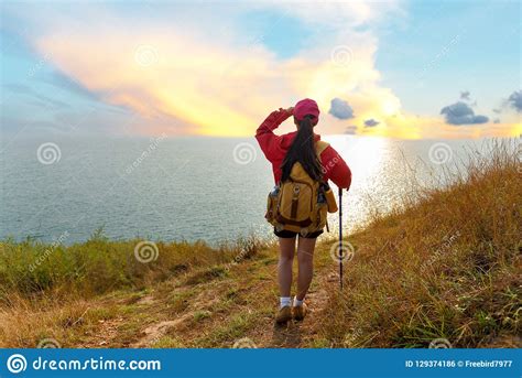 Hiker Woman Climb Up The Last Section Of Sunset In Mountains Near The ...