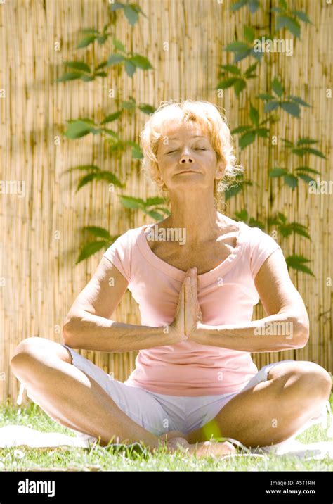 Senior Woman Doing Yoga Outdoors Stock Photo Alamy