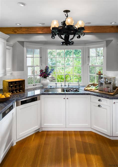 A Bay Window At One End Of This Cabinetry Countertop Cuisine