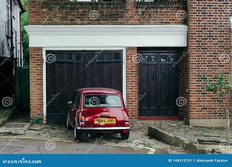 Red Oldstyle Mini Parked In Front Of The Garage Editorial Photo Image