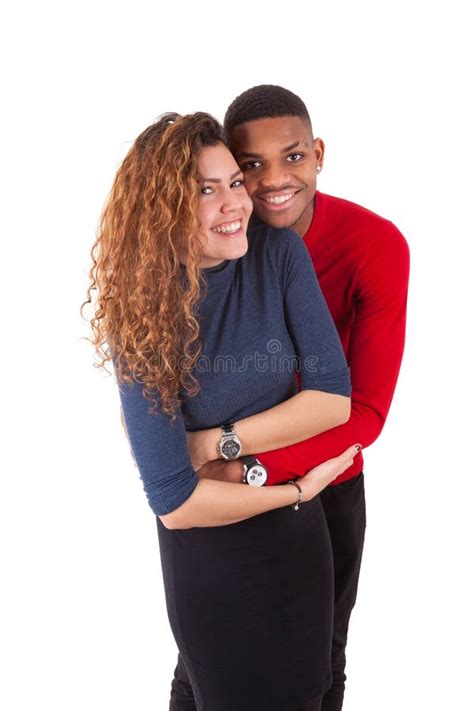 Happy Mixed Race Couple Hugging Over A White Background Stock Image