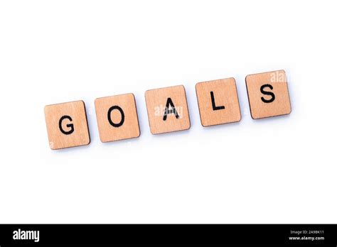 The Word Goals Spelt With Wooden Letter Tiles Over A White Background